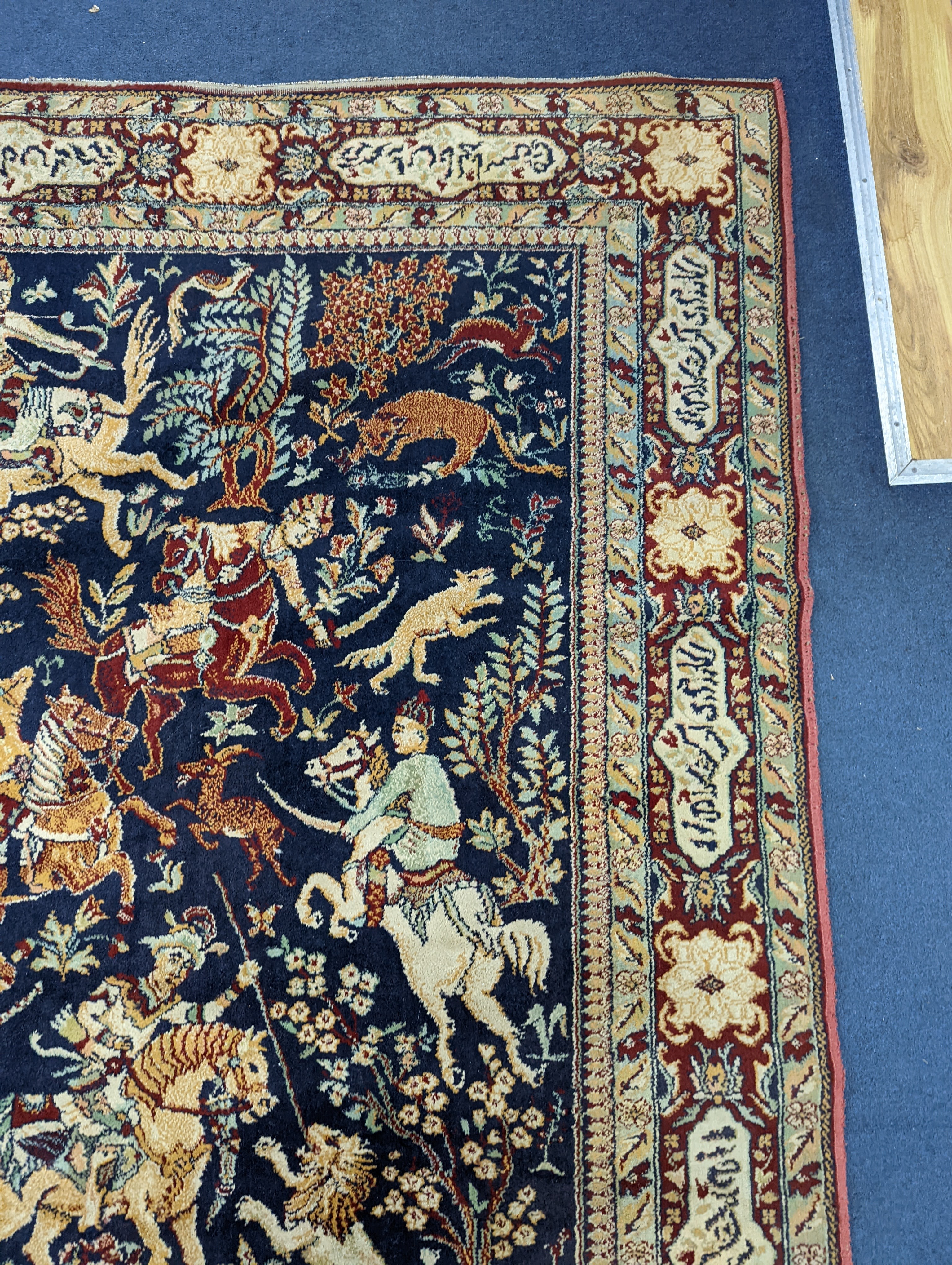 A Kashan style blue ground pictorial rug, 224 x 144cm